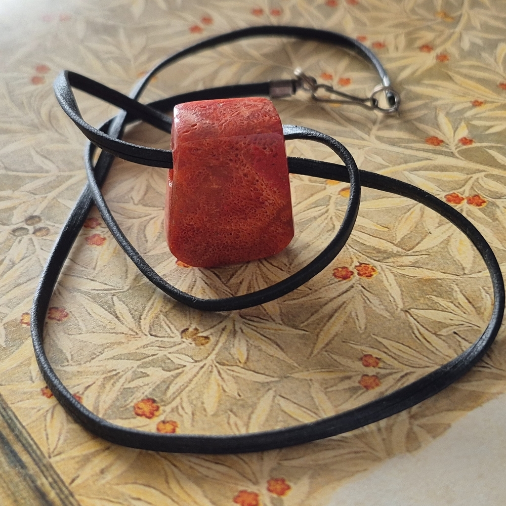 CHUNKY FOSSILIZED CORAL PENDANT ON A LEATHER CHAIN